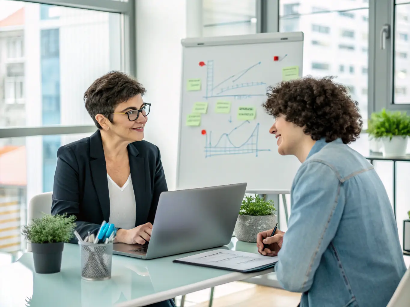 A professional business coach in a modern office setting, guiding a client through a strategic planning session, with visual aids like charts and graphs displayed on a screen in the background.